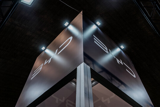 BELGRADE, SERBIA - MARCH 22, 2026: Close view of a large BYD logo mounted on a dark illuminated display structure in Belgrade, Serbia,BYD is a chinese automaker specialized in electric cars and SUVs.