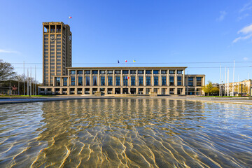 Naklejka premium Le Havre City Hall reflected in fountain water, modernist concrete architecture by Auguste Perret in Normandy, France