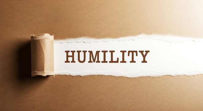Torn paper revealing humility message, symbolizing modesty and simplicity