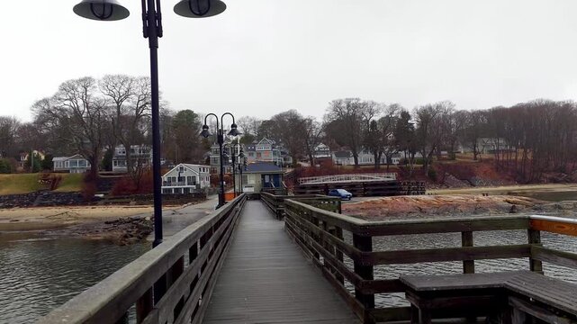 Long pier leading to shore Town Landing Harbor Falmouth, Maine