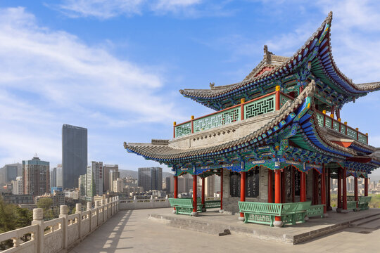 The ancient Dongfeng Pavilion in White Pagoda Mountain Park harmoniously blends with the modern city skyline of Lanzhou