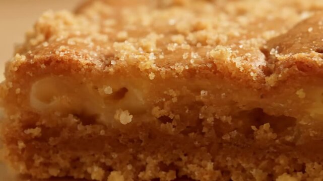 Close-up of australian blondie dessert bar with crumb topping, macro shot