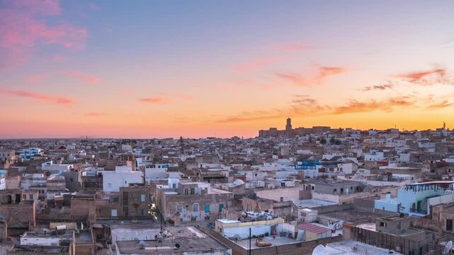 Panorama at Sunset over the historic medina of Sousse, Tunisia, with dense urban rooftops and warm evening light, evoking culture, tradition, everyday city life, North African atmosphere