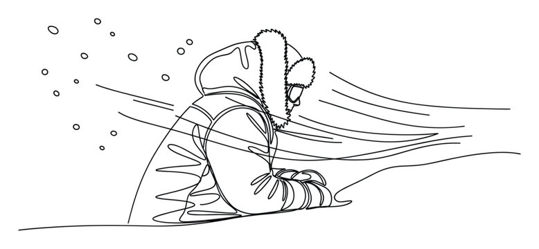 Determined person in a warm furhooded jacket confronting a harsh winter blizzard with strong winds and falling snow, ideal for seasonal graphics and adverse weather condition reports.