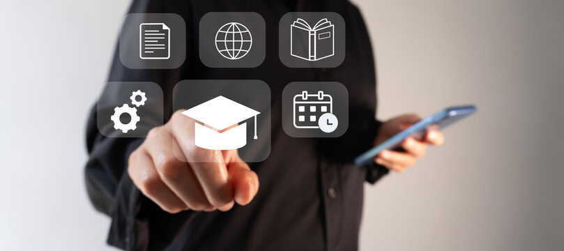 Hand taps digital icons representing education and technology. Professional tone suggests innovation in learning and development.