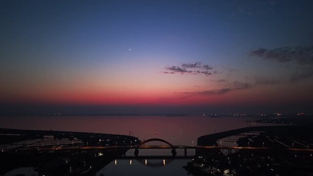 aerial view bridge and lake at sunset