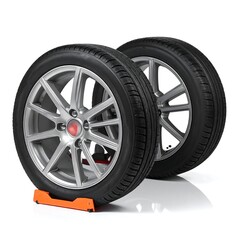 Obraz premium Two car tires with silver rims are displayed. They sit on an orange support stand against a white background