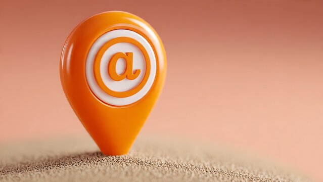Email location pin orange map marker with at symbol placed in sand represents digital communication and internet address for online business and contact points