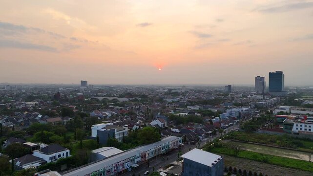 Golden sunrise over Solo Baru skyline, Central Java, Indonesia.
