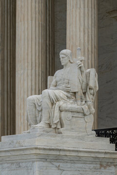 Justice statue symbolic allegory. Supreme court architecture classical exterior. Law constitution judicial authority legislation. Marble legal background.