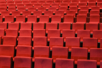 Fototapeta premium Red empty seats in the theater auditorium