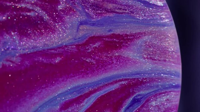Sparkling flow curve. Ink swirl. Pink purple shimmering acrylic emulsion mixing color stream in sphere abstract violet blur background.