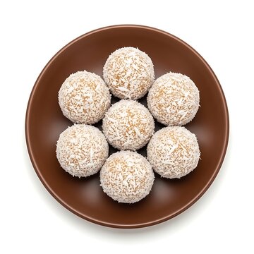 A plate of coconut ladoo sweets on a white background
