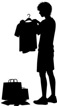 Silhouette of a young man holding a shirt on a hanger with shopping bags on the floor