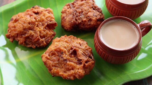 Ulli vada spicy onion fritters popular South Indian deep fried tea time snack with onion Kerala India . Indian . Traditional Indian food for Ramadan Ramzan. Kerala snack.	