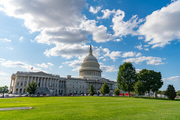 Naklejka premium Capitol dome. Historic Capitol by the national flag. Capitol dome as symbol of law. Washington monument architecture. Washington DC. US Senate