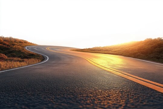 Empty winding two-lane road curving through grassy hills at sunrise with golden light, serene and inviting mood