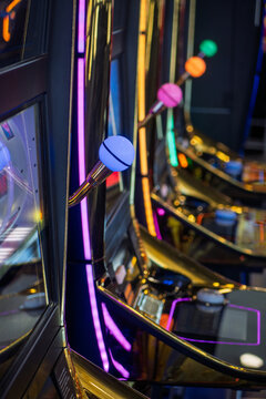 Row of bright slot machines in a casino