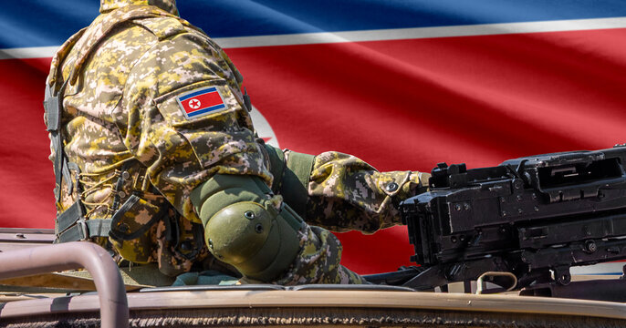 North Korea flag with soldier at machinegun turret