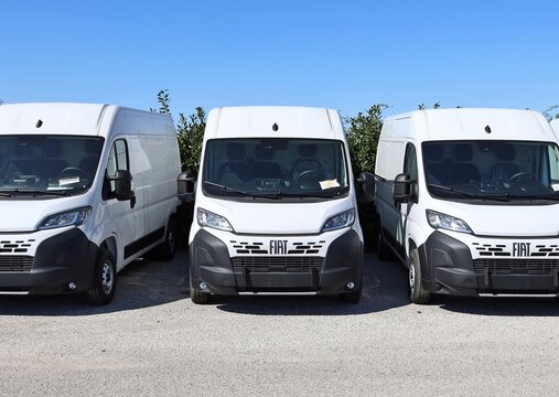 Tavagnacco, Italy. April 3, 2026. White vans Fiat Ducato lined up by the dealership. Front view.