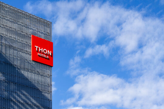 Oslo, Norway - April 07, 2026: Thon Hotels Modern Architectural Facade Red Branding Signage