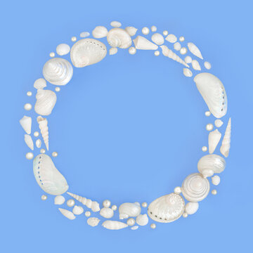 Seashell wreath decoration of white and mother of pearl shells with pearls on blue background. Decorative design coastal themed decor for greeting card, logo.
