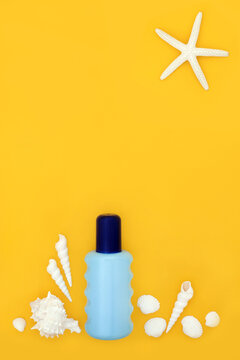Summer beach suntan lotion beach abstract fun design with blue container bottle, starfish sun and white sea shells on yellow background. Symbols for the holiday season.