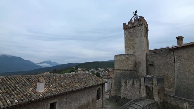 Exterior View of the Medieval Piccolomini Castle with Ancient Stone Walls and Towers in Capestrano, Abruzzo, Italy