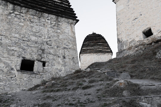  Ancient stone crypts with traditional stepped roofs in Dargavs necropolis, North Ossetia-Alania, Russia.