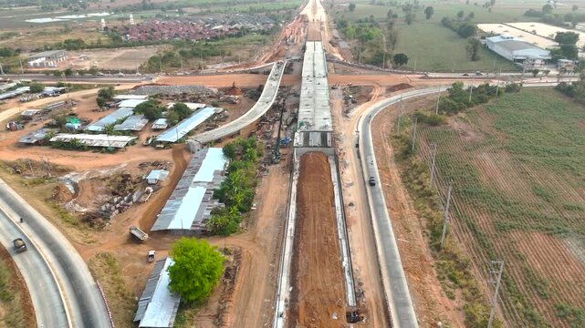 Drone footage a construction working tractor is refining the soil in preparation for laying asphalt The process of making a highway