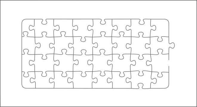 A puzzle with many pieces lies unsolved on a surface