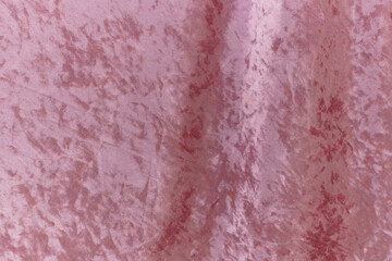 Fototapeta premium Beautiful crushed velvet fabric in a soft pink color.