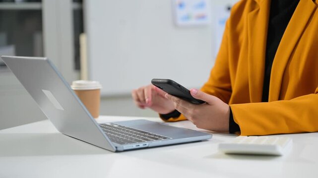 Women counting coins on calculator taking from the piggy bank. hand holding pen working on calculator to calculate on desk about cost