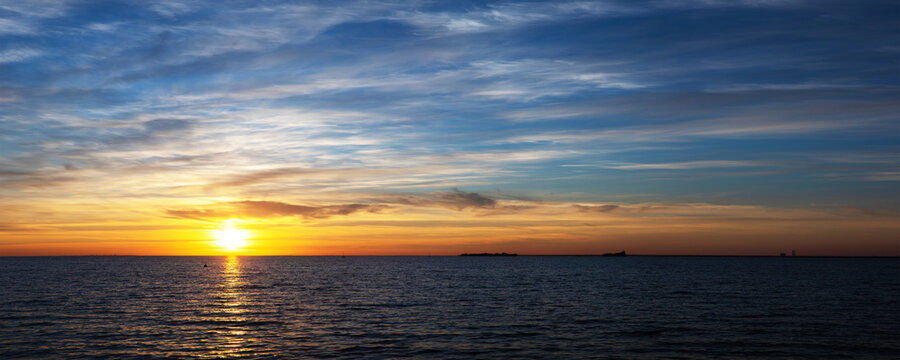 setting sun on the sea, beautiful sunset with colorful sky