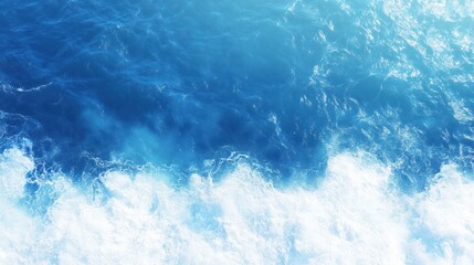 Obraz premium Azure Majesty: A mesmerizing aerial view unveils the dance of ocean waves in a symphony of blues and whites, as they churn and crash with untamed power.