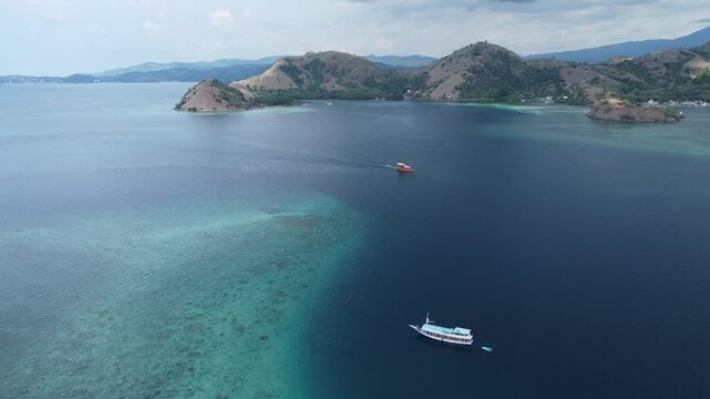 Aerial Drone View of Boats Over Turquoise Sea in Labuan Bajo