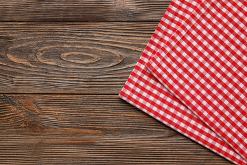 Obraz premium Checkered napkin on wooden table