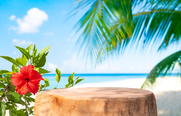 Empty old tree stump table top with beautiful red flower on blurred tropical sea and palm background for product display © didecs