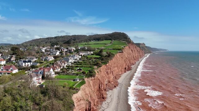 Cliff edge houses on red cliffs Sidmouth Devon aerial