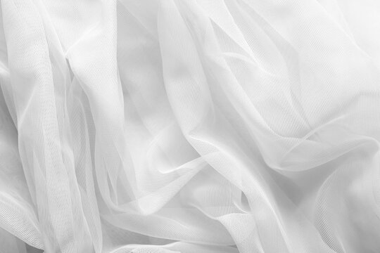 White tulle fabric as background, top view
