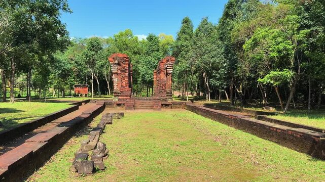Panoramic view of My Son Sanctuary ancient Cham Hindu temple ruins surrounded by lush tropical greenery near Hoi An, Vietnam. UNESCO World Heritage Site.