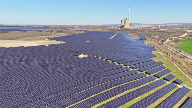Aerial drone view to a solar park near to defunct coal-fired power plant in Stara Zagora Region, Bulgaria