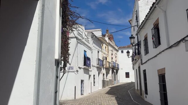 Zafra white streets, POV walk through alley bright daylight.