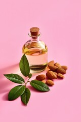 Naklejka premium Tall bottle of almond oil with leaves and almonds on pink