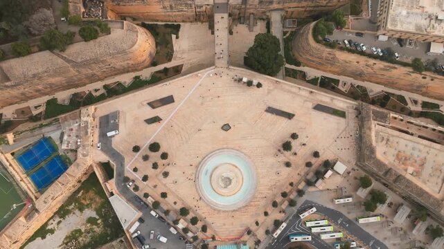 Tritons' Fountain Drone view of Valletta, Malta, showing historic fortifications, old town streets, waterfront edges and landmark architecture. Aerial cityscape scene with Mediterranean atmosphere