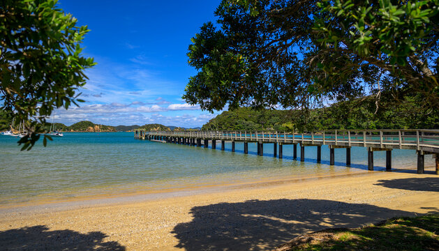 Paihia wharf extending into tranquil bay of islands water