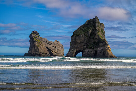 Wharariki beach archway islands rock formations pacific ocean, new zealand