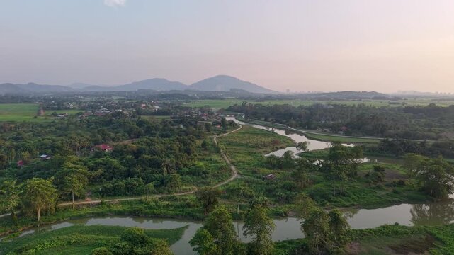 Aerial drone view of Labuh Banting river and fields