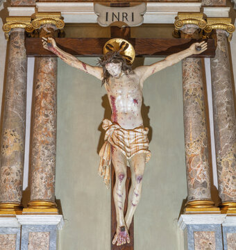 MONZA, ITALY - MARCH 19, 2026:  The carved polychrome Crucifixion in the church Chiesa di Santa Maria al Carrobiolo by Battista da Saronno from 16. cent. 