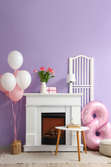 Obraz premium Interior of living room decorated for Women's Day with fireplace and balloons